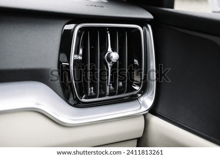 Deflector. car ventilation system. Car air conditioner closeup. Detail interior. Air ducts. Automotive climate control. Airflow inside the car. Interior element of a modern premium car.