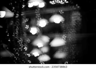 Defocus blur background, blurred light bokeh in black and white, christmas light bokeh