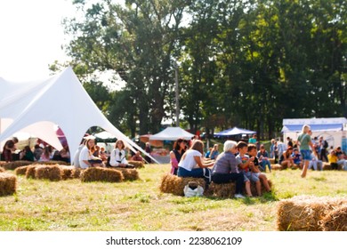 Defocus blur background of people, family in park fair, festive summer, music festival tent. Festival Event Party with People Blurred Background. Summer. Out of focus. - Powered by Shutterstock