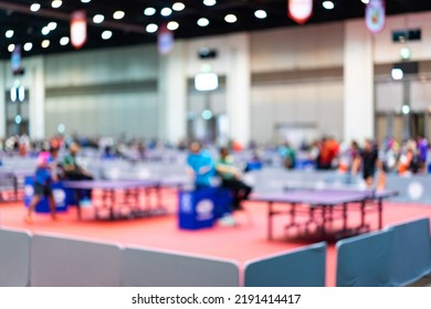 Defocus Blur Background Of Table Tennis Tournament Competition In An Indoor Stadium.