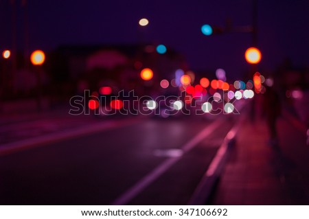 Defocus and blur image of city at night, Blur traffic road with bokeh light abstract background. Retro pink light style