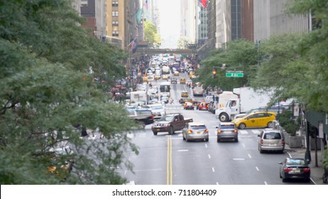 Defocus Blur Long View Down 42nd Street In Manhattan. Overhead Shot Of Busy Rush Hour Midtown Traffic. Bus, Car, Personal Vehicle Occupy Street