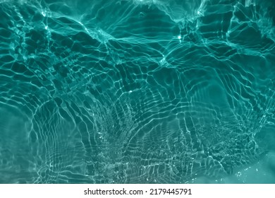 Defocus blurred blue water shining in the sea. rippled water detail background. The water surface in the sea, ocean background. Water is inorganic, transparent, tasteless, odorless, nearly colorless.