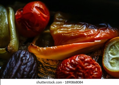 Defocus Close-up Of Baking Veggies Vegetables. Roasted Peppers, Zucchini, Tomato, Onion. Homemade Grill Dish. Foil On Baking Sheet. Healthy Food. Out Of Focus.