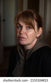 Defocus Portrait Of Young Ukrainian Woman. Mental Health. 40s Years Woman Sad, Serious, Have Problems And Depression. Psychology Concept. Stress And Pain. Dark Background. Out Of Focus.