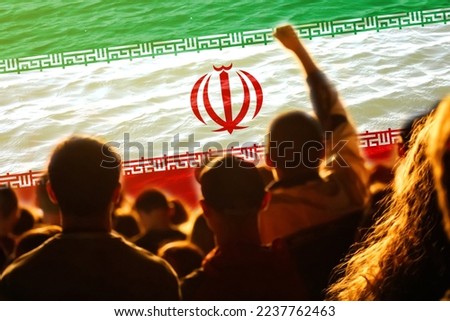Defocus protest in Iran. Conflict war over border. World crisis. Country flag. Woman low rights. Male hands. Out of focus.