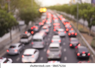 defocus rush hour traffic jam in ratchayothin,bangkok,thailand