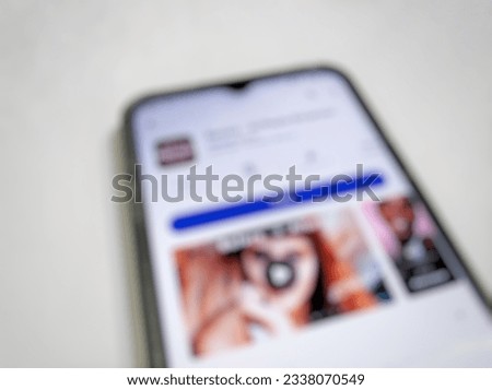 Defocused abstract background of an app on the Android PlayStore white background shot in the studio.