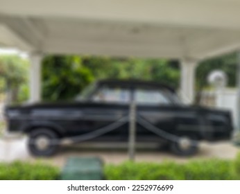 a defocused abstract background of black Opel Kapitän car which was used by Bung Tomo in heroes monument (tugu pahlawan) surabaya