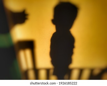 Defocused abstract background of  blurred kids shadow reflected on the wall. 