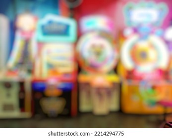 Defocused abstract background close up image of arcade game machine in Mall. Bokeh image of the game zone for background usage.