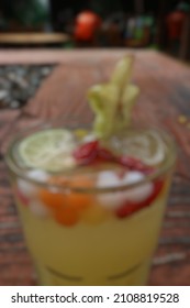 Defocused Abstract Background Of A Drink With Starfruit As A Garnish