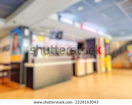 Defocused abstract background of Empty Fast food Restaurant counter inside modern shopping mall or shopping center. Bokeh fast food restaurant interior with vintage tone effect image 