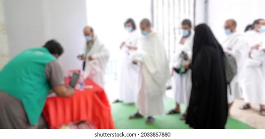 Defocused Abstract Background Of Hajj Pilgrims Who Are Queuing, During The Covid 19 Pandemic And Wearing Masks And Obeying Isolation Protocols