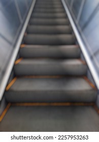 Defocused abstract background modern escalator steps with no people. - Shutterstock ID 2257953263