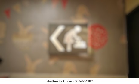 Defocused Abstract Background Of  Nursing Room Sign For Breastfeeding