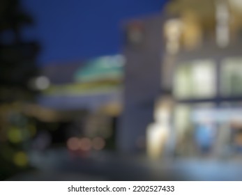 Defocused Abstract Background Of An Office Building At Night. Abstract Blurred Background.