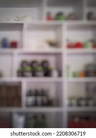 De-focused Abstract Background Of Organized Pantry Items In Kitchen Storage.