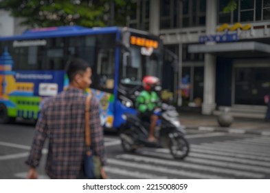 Defocused Abstract Background Of Pedestrians Are Crossing Through The Zebra Crossing