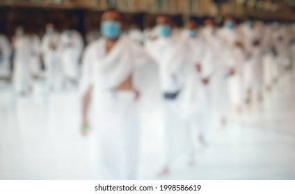 Defocused Abstract Background Of Pilgrims Of The Mecca Of Medina During The COVID-19 Pandemic And Social Distancing And Wear A Mask