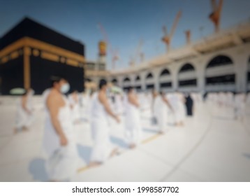 Defocused Abstract Background Of Pilgrims Of The Mecca Of Medina During The COVID-19 Pandemic And Social Distancing Social And Wear A Mask