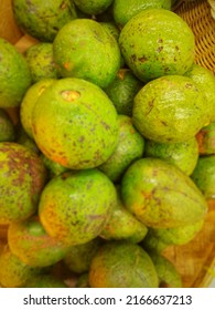 Defocused Abstract Background Of Raw Avocados (Persea Americana) At Traditional Market