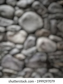 Defocused Abstract Background Of River Rock Wall