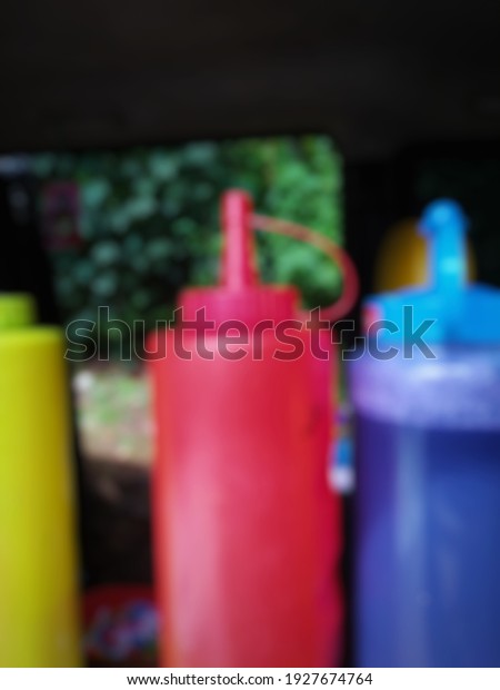 defocused\
abstract background of sauce bottle in the\
car