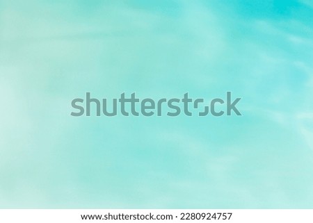 Defocused abstract background seawater gradient color, blue, turquoise, green, mint colors. Different tints sea water as blurred wallpaper, fon, backdrop, design elements. Pastel colored summer tones