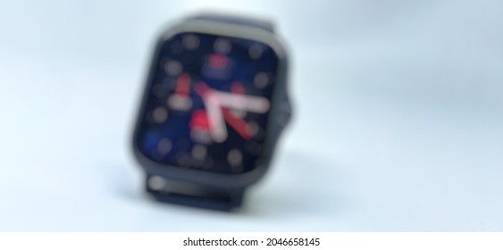 Defocused abstract background of smartwatch with a cool watchface