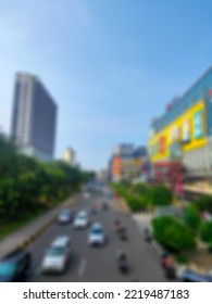 Defocused Abstract Background Of Smooth Traffic Conditions In The Middle Of The City