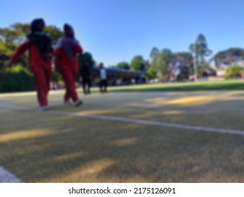 Defocused Abstract Background Of Some People Wearing Red Shirts Are Running