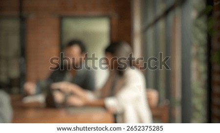 Defocused abstract background of startup founders sharing ideas in a modern office meeting. fits innovation, startup culture, and teamwork visuals.
