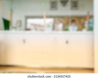 Defocused Abstract background of Typical Indonesia pawnshop Interior. Bokeh image inside pawnshop in front the counter with vintage tone effect.