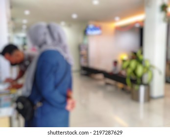 Defocused Abstract Background Of Typical Indonesia Bank Interior With Customer. Bokeh Image Inside Bank Branch 