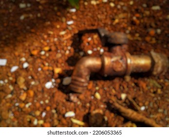 Defocused abstract background used water faucet above ground