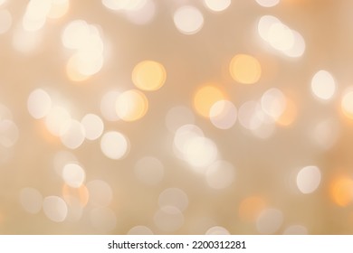 Defocused Abstract Bokeh Background Beige Pastel Colored, Flare From Lights, Beige Monochrome Photo, Blurred Round Bokeh As Holiday Fon, Celebration Wallpaper. Glittering Aesthetic Textured Pattern