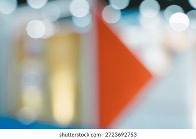 Defocused abstract image with triangular shape and blue and white background
