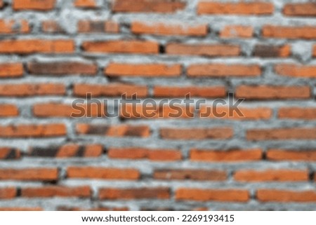 Defocused abstract shot of red brick texture background. Brick wall. Ancient brick wall pattern. Red brick wall