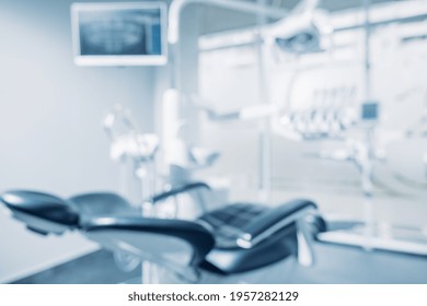 Defocused Background And Copy Space Image Of Dental Office With Dentist Chair And Equipment