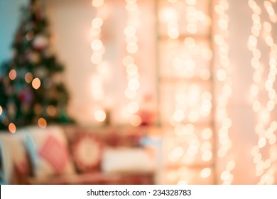 Defocused Background Living Room With Christmas Tree. Pink Toned