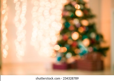 Defocused Background Living Room With Christmas Tree. Pink Toned