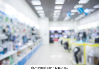 Defocused Background Of Real Shopping Mall, Gadget Store.