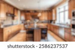 Defocused Background of Spacious Modern Kitchen with Wooden Cabinets and Island Featuring Granite Countertop and Natural Light. Blurred Background Photo.