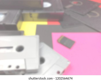 Defocused background of tapes, floppy disk and memory card. Intentionally blurred post production for bokeh effect.