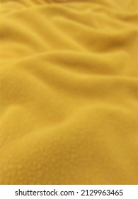  Defocused Background Of A Tawny Thick Blanket With A Soft Structure.