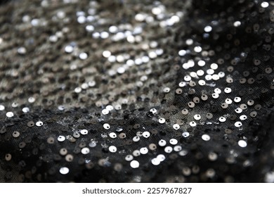 defocused black and silver knitted fabric with sequins and folds texture background	 - Shutterstock ID 2257967827