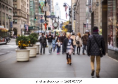 Defocused blur of New York City street with crowd of people walking