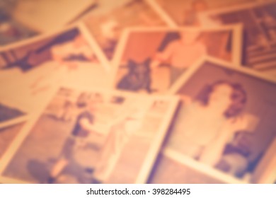 Defocused Blur Of Scattered Old Family Photographs 