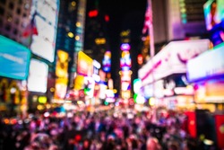 Defocused Blur Of Times Square In New York City, Midtown Manhattan At Night With Lights And People.